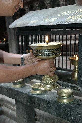 Making a large Tibetan Buddhist butter lamp offering to Lord Buddha, Mahabuddha Temple, also known as "temple of thousand buddhas", skikhar style buddhist temple, Kathmandu, Nepal by Wonderlane