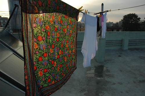 Scarf, underwear, air drying laundry, passive solar waterheaters, rooftop laundry drying, Tharlam Monastery Guesthouse, Boudha, Kathmandu, Nepal by Wonderlane
