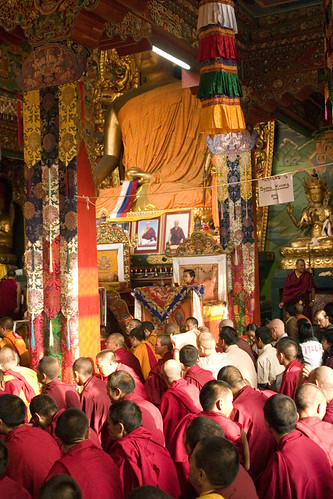 7 year old reincarnate Tibetan Lama HE Dhungsey Asanga Sakya on his throne, with monks and practioners Tharlam Monastery, Boudha, Kathmandu, Nepal by Wonderlane