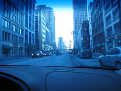 Downtown Detroit as seen through a car windshield.
