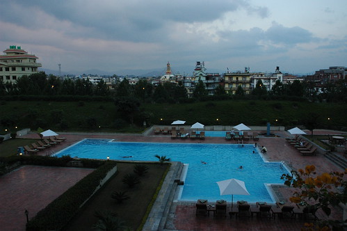 Large swimming pool in view of the Boudha Stupa, in the evening, Hyatt Regency Hotel, Boudha, Kathmandu, Nepal by Wonderlane