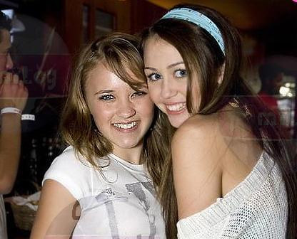 Miley Cyrus and Emily Osment They act like sisters on Hannah Montan its 