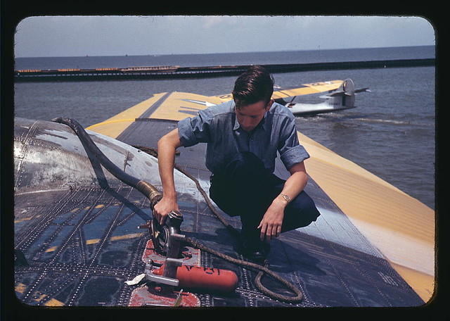 A sailor mechanic refueling a plane at the Naval Air Base, Corpus Christi, Texas (LOC)
