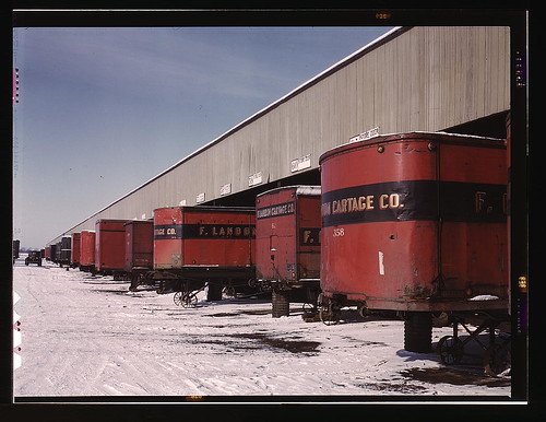 Truck trailers line up at a freight house to load and unload goods from the Chicago and Northwestern railroad, Chicago, Ill.  (LOC)
