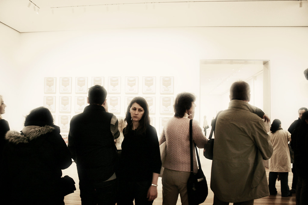 Museum Goers Viewing Andy Warhol's Campbells Soup Can Paintings