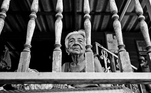 Older Elderly sister looking down - bangkok