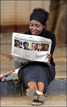 Zimbabwe resident reads the pro-government newspaper which explains how the imperialist nations are working to overthrow the ZANU-PF ruling party. by Pan-African News Wire File Photos