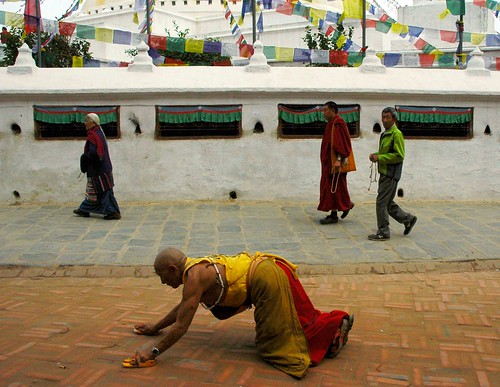 Tibetan Buddhist monk prostrator ... Boudha stupa, Buddhists, prayer flags, walkway, Boudha circle, Kathmandu, Nepal by Wonderlane