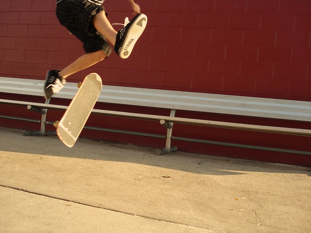 Varial Kickflip Perfect action shot in the middle of a varial flip