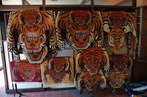 Tiger rugs, Boudha, Kathmandu, Nepal by Wonderlane