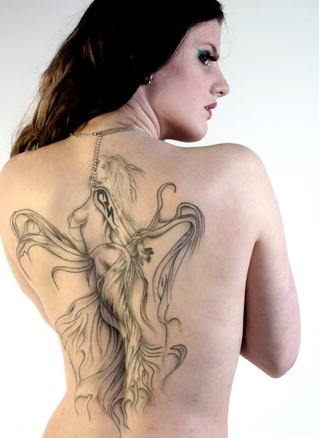  80 Beautiful tattoo on womans back model work in the studio