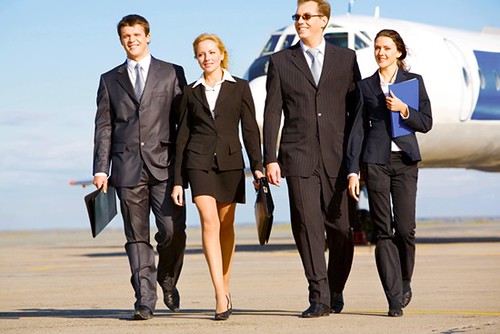 a group of professionals leaving an airplane