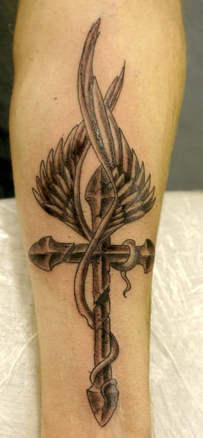 cross with wings tattoo Tattooed by Johnny at The Tattoo Studio