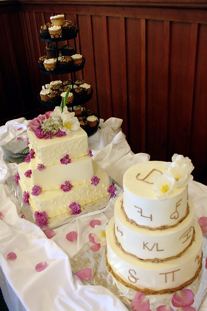 A western wedding cake table One for him one for her and a few dozen