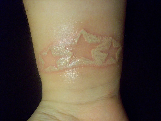 White ink star tattoo White ink blood shaded tattoo