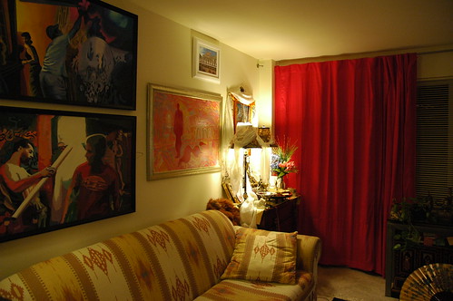 My old apartment living room, paintings, Buddhist shrine, lamps, red curtains, gold fan, southwest style fabric sofa, stuffed red ape Dezhung Rinpoche gave me when he was a little kid, Seattle, Washington, USA by Wonderlane