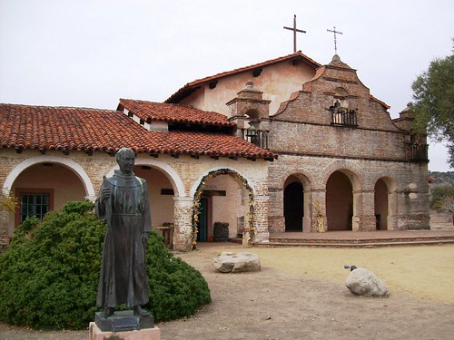 Mission San Antonio de Padua, chapel entrance and statue of Father Junipero Serra in remote Monterey County, CA - sanantonio004x