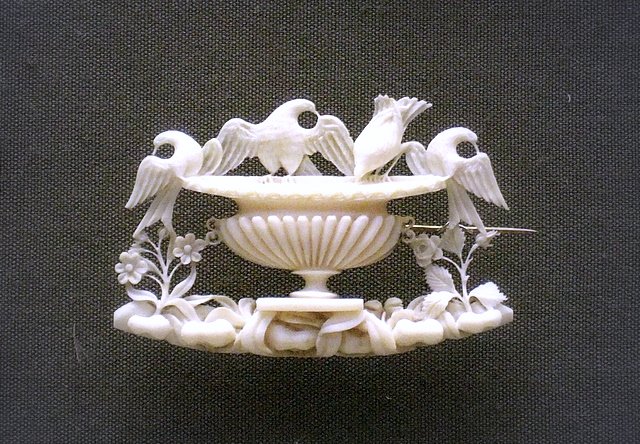 Carved ivory brooch