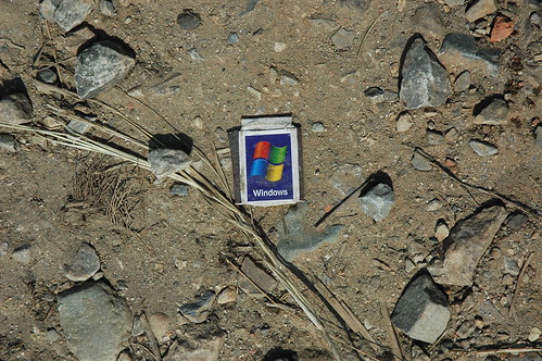 Microsoft Windows matchbox on the ground in rural Nepal. Found object. by Wonderlane
