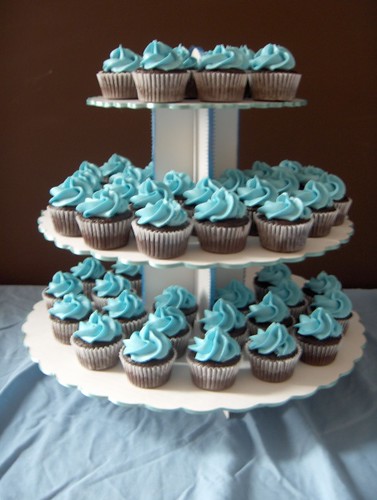 Simple chocolate mini cupcakes with blue icing for a wedding