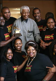 Former South African President Nelson Mandela hosting the grammy-award winning Soweto Gospel Choir who paid him a visit on Wednesday, March 26, 2008. by Pan-African News Wire File Photos