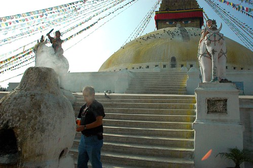 Saying farewell to a friend, sur smoke, making offerings at the wish fulfilling stupa in honor of the death of a friend, statues, prayer flags, white elephants, white wash, Boudha, Kathmandu, Nepal by Wonderlane