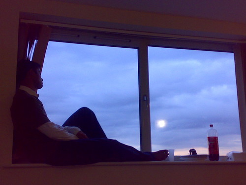 I sit beside the window..