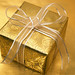Gift box wrapped in gold paper