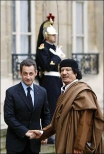 French President Sarkozy and Libyan leader Mummar Gadaffi during the North African head of state's visit to Paris. A deal was sealed involving arms and nuclear energy. France later bombed the country and sent military advisors for regime change. by Pan-African News Wire File Photos