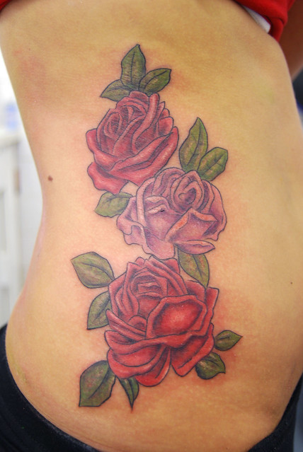 roses on side tattoo Tattooed by Johnny at The Tattoo Studio