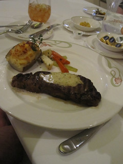 Grilled NY Strip Steak Thyme Roasted Vegetables, Double-baked Potato topped with handmade Herb Butter.