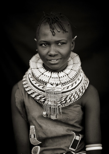 Turkana girl with pendants on her bead necklace - Kenya