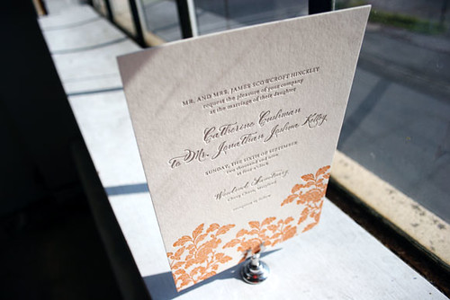 Orange and gray letterpress wedding invitations in our Rhon design 