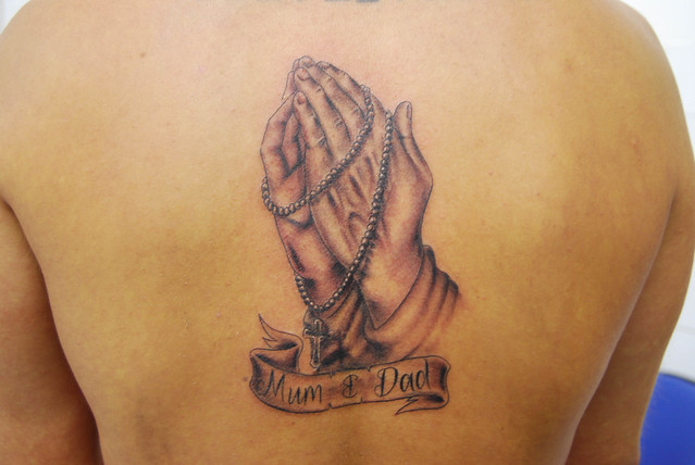 praying hands revisited tattoo