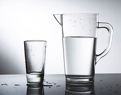 Pitcher of water with glass cup