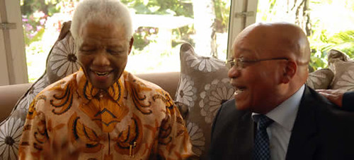 Former South African President Nelson Mandela and current President Jacob Zuma enjoy a laugh at Madiba's 91st birthday celebration on July 18, 2009. by Pan-African News Wire File Photos