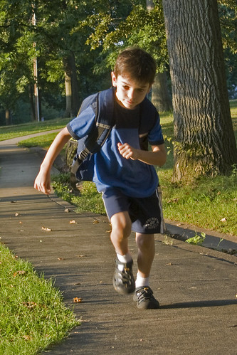 boy, with back pack, running
