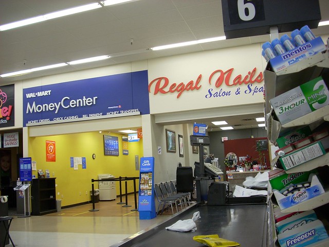 A Wal-Mart Money Center and a Regal Nails Salon & Spa inside a Wal-Mart