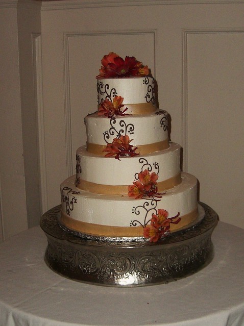 Brown and Gold Wedding 4 tier buttercream covered with chocolate piping and