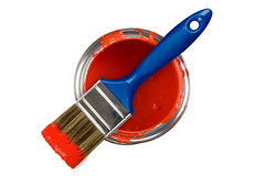 Red paint can with brush