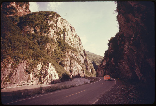 Inside Keystone Canyon, Looking South Along the Richardson Highway. The Cliffs at the Left Climb More Than 1,000 Feet Above the Rushing Waters of the Lowe River. Mile 766, near the Alaska Pipeline Route 08/1974