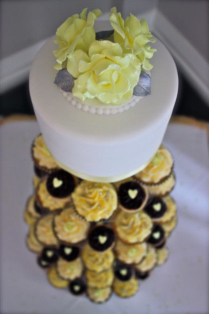 Yellow Rose Wedding Cupcake Tower Pale yellow sugar roses with a hint of 