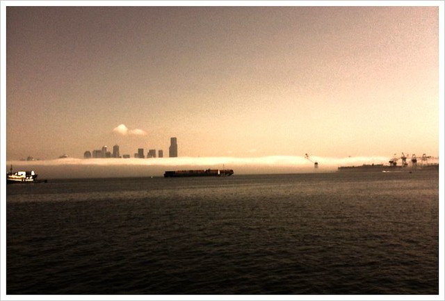 Morning fog crawling it's way south through Elliot Bay, Seattle Washington