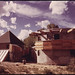 Architect and Experimental House Builder Michael Reynolds Lives in This Structure Which Is a Compendium of His Experiments in the Field, near Taos, New Mexico. the Left Portion of the Structure with the Pyramid-Shaped Roof Has Been Built Using Empty Cans