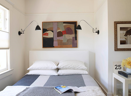White bedroom + symmetry: Gray blanket + modern art + sconces ...