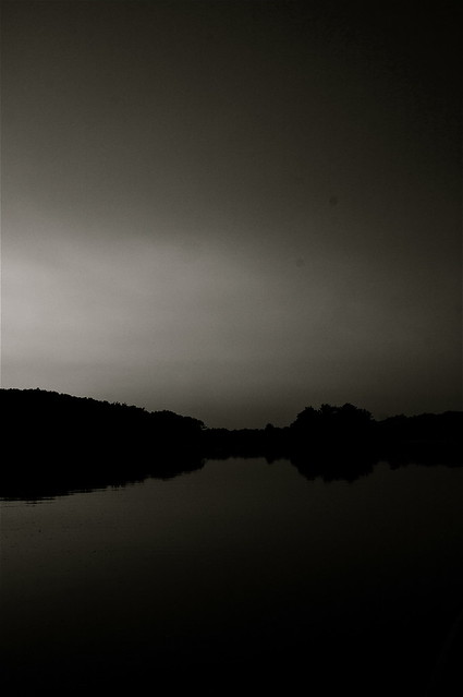 sunset on the river in b&w
