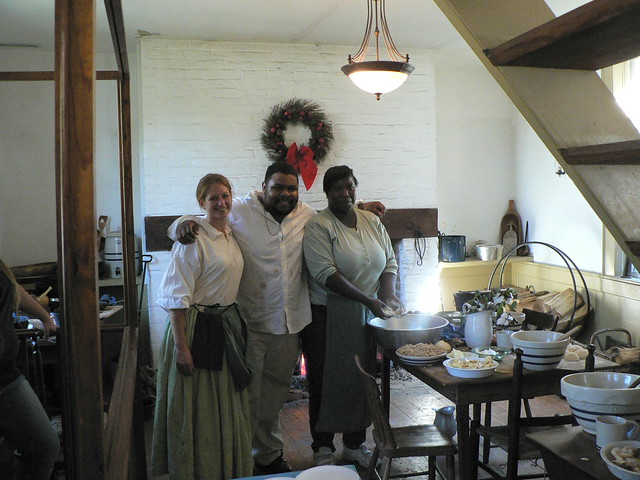 Culinary history and blogger, Michael Twitty, works in the Brick Kitchen with park staff.