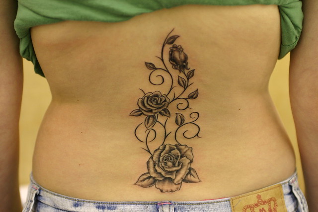 Roses and vines up spine tattoo Tattooed by Johnny at The Tattoo Studio