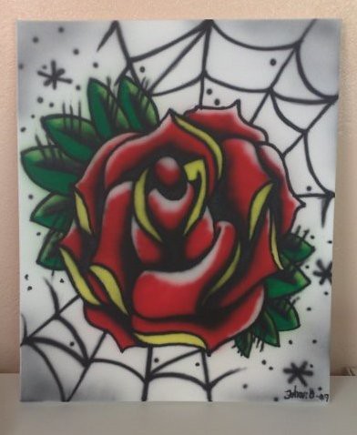 A traditional tattoo rose made with airbrush on canvas