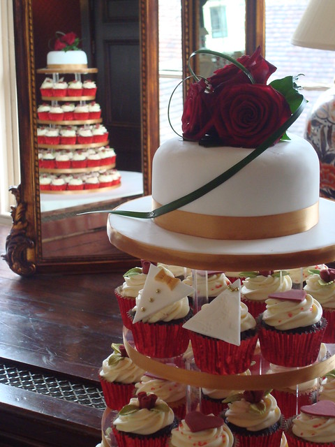 Red gold wedding cupcake tower Selection of vanilla chocolate cupcakes 